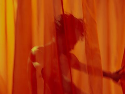 Person performing a fluid movement on a mat